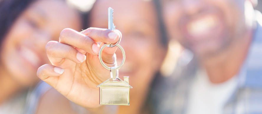 Happy family with house key